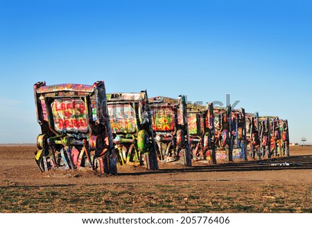 AMARILLO, TEXAS, USA - DEC. 2013: Cadillac Ranch is a public art installation and sculpture in Texas, U.S. created in 1974 by Chip Lord, Hudson Marquez and Doug Michels, of the art group Ant Farm.