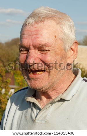 portrait of real old laughing man
