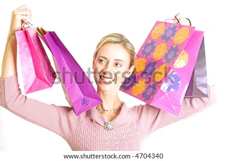 Lady with hands full of bags after a day at the shops