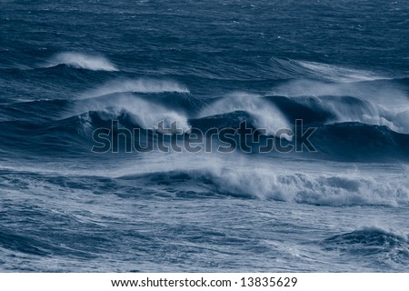 Blue waves on a stormy day at the sea