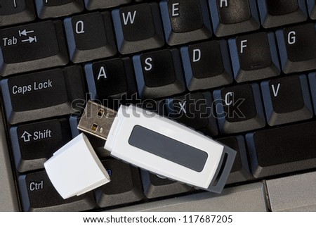 An open USB memory stick on a keyboard