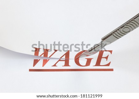 A scalpel cutting through the word Wage. Concept denoting a wage or salary cut, or reduced income because of a falling economy.