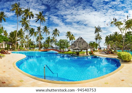 Recreation area with swimming pool on the tropical beach