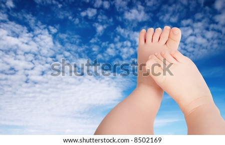 Similar – Image, Stock Photo Baby legs dangling from high chair; baby wearing turquoise outfit with bare feet against white wood background