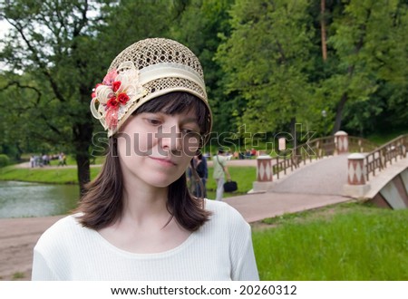 Portrait of the woman in an old-fashioned hat