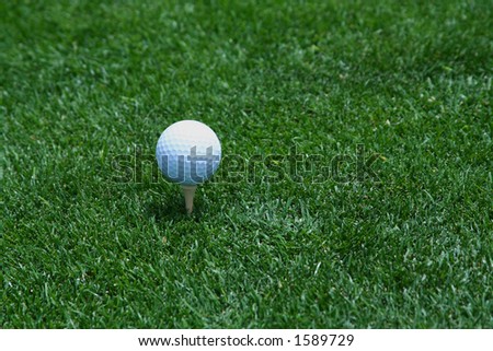 Golf ball on tee with space for logo on golf ball