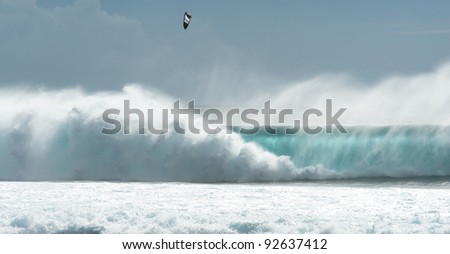 kitesurfing and surfing on huge waves of the Indian Ocean island of Mauritius