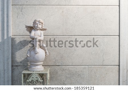 Marble angel statue on a table/Front house decorative statue/Marble angel on wooden table in front of the house