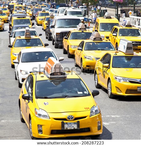 NEW YORK CITY - JUNE 28, 2014: Taxi cabs lining the city street during typlical daily traffic New York City on June 28th, 2014