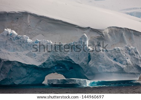 Huge iceberg, bizarre, floating off the coast of Antarctica Antarctica