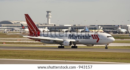 A Martin Air plane on the runway at Toronto Pearson Airport.