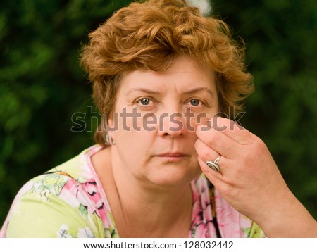 Portrait of an middle-aged woman deep in thought