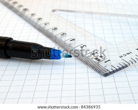 Ruler, pen and notebook on white background
