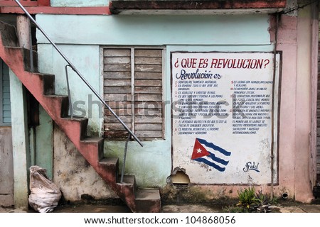 BARACOA, CUBA - FEBRUARY 14: Wall mural celebrates Revolution and Socialism on February 14, 2011 in Baracoa, Cuba. Cuban Revolution brought famous Fidel Castro to power in 1953.