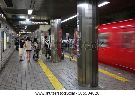 NAGOYA, JAPAN - APRIL 28: Commuters wait for Nagoya Subway on April 28, 2012 in Nagoya, Japan. Nagoya Subway is among top 30 busiest metro systems worldwide with 427 million annual rides.