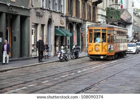 MILAN - OCTOBER 7: Historic tram rides on October 7, 2010 in Milan. Milan transportation system carries 1.7 million passengers daily (2007 data).