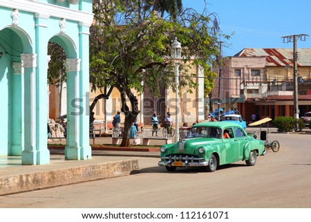 REMEDIOS, CUBA - FEBRUARY 20: Man drives old American car on February 20, 2011 in Remedios, Cuba. New change in law allows Cubans to trade cars. Cars in Cuba are very old because of the old law.