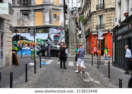 PARIS - JULY 22: Tourists visit Montmartre district on July 22, 2011 in Paris, France. Paris is the most visited city in the world with 15.6 million international arrivals in 2011.