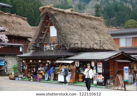 SHIRAKAWA, JAPAN - APRIL 28: Tourists visit old village on April 28, 2012 in Shirakawa-go, Japan. Shirakawa is one of most popular attractions in Japan, listed as UNESCO World Heritage Site since 1995
