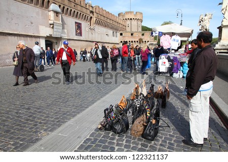 ROME - APRIL 9: Immigrants sell counterfeit goods on April 9, 2012 in Rome. Fake products sold in streets of Italian cities are considered nationwide problem, but the police can\'t seem to stop it.