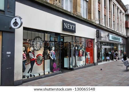 WOLVERHAMPTON, UK - MARCH 10: People shop at Next and Marks & Spencer stores on March 10, 2010 in Wolverhampton, UK. M&S has 1,010 stores in 40 countries.