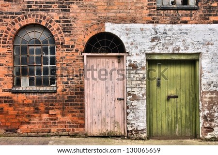 Window and doors in old warehouse. Abandoned factory building. Birmingham in West Midlands, England.