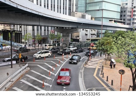 OSAKA, JAPAN - APRIL 25: Cars drive in heavy traffic on April 25, 2012 in Osaka, Japan. According to Tripadvisor, it is currently among best 3 shopping places in Osaka.