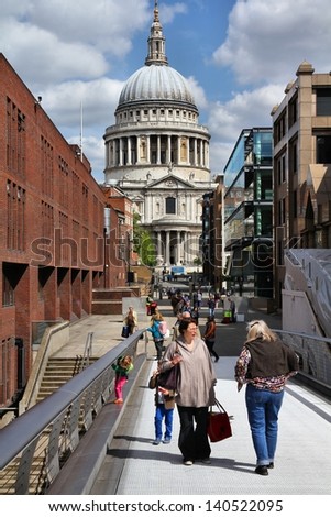 LONDON - MAY 13: Tourists visit St. Paul\'s Cathedral on May 13, 2012 in London. With more than 14 million international arrivals in 2009, London is the most visited city in the world (Euromonitor).