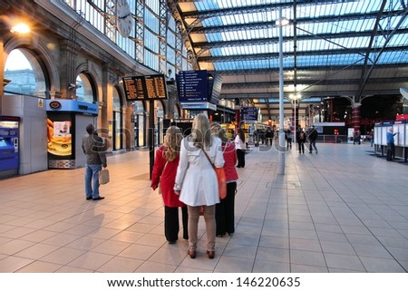 LIVERPOOL, UK - APRIL 20: People wait at Lime Street station on April 20, 2013 in Liverpool, UK. With 13.8m annual passengers (2012) it is the busiest station in Liverpool and one of 30 busiest in UK.