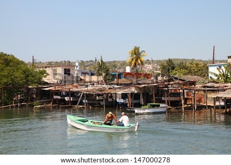 MATANZAS, CUBA - FEBRUARY 22: Men go fishing on February 22, 2011 in Matanzas, Cuba. With constant deficit of basic food products in Cuba, fishing is a popular activity.