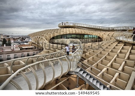 SEVILLE, SPAIN - NOVEMBER 4: People visit Metropol Parasol on November 4, 2012 in Seville, Spain. Metropol Parasol claims to be the largest wooden structure in the world.