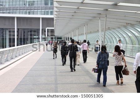 YOKOHAMA, JAPAN - MAY 10: People walk in modern area of the city on May 10, 2012 in Yokohama, Japan. Yokohama is the 2nd largest city in Japan by population after Tokyo with almost 3.7m people.
