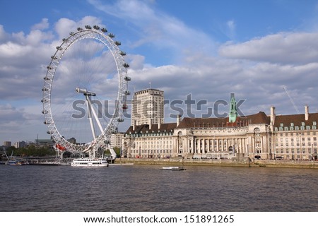 LONDON - MAY 14: People ride London Eye on May 14, 2012 in London. The Eye is the tallest ferris wheel in Europe.