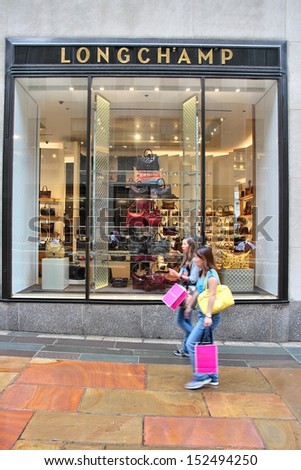 NEW YORK - JULY 1: People walk past Longchamp store on July 1, 2013 in New York. The famous leather goods company has some 2,000 stores in some 100 countries worldwide.