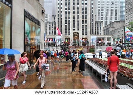 NEW YORK - JULY 1: People visit Rockefeller Center on July 1, 2013 in New York. Rockefeller Center is one of most recognized landmarks in the United States and is a National Historic Landmark.