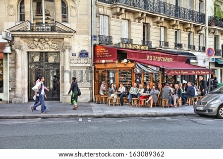 PARIS - JULY 23: People visit Cafe Au Sauvignon on July 23, 2011 in Paris, France. Paris is the most visited city in the world with 15.6 million international arrivals in 2011.