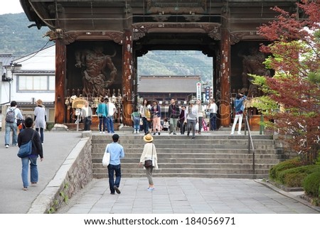 NAGANO, JAPAN - MAY 1, 2012: Tourists visit famous Zenkoji temple in Nagano, Japan. The temple is designated as National Treasure of Japan.