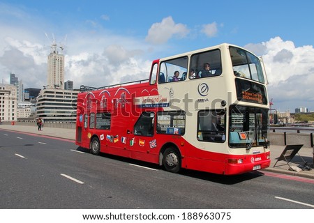 LONDON, UK - MAY 15, 2012: People ride sightseeing bus in London. With more than 14 million international arrivals in 2009, London is the most visited city in the world (Euromonitor).