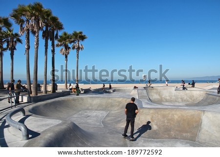 VENICE, UNITED STATES - APRIL 6, 2014: People visit skate park at Venice Beach, California. Venice Beach is one of most popular beaches of LA County. 9.8 million people live in LA County.