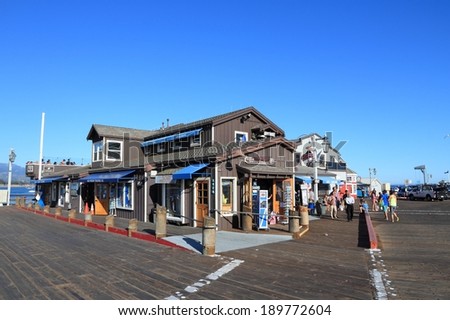 SANTA BARBARA, UNITED STATES - APRIL 6, 2014: People visit Stearns Wharf in Santa Barbara, California. It was completed in 1872 and is a popular tourist destination.