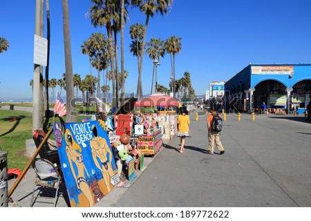 VENICE, UNITED STATES - APRIL 6, 2014: People visit Ocean Front Walk at Venice Beach, California. Venice Beach is one of most popular beaches of LA County. 9.8 million people live in LA County.