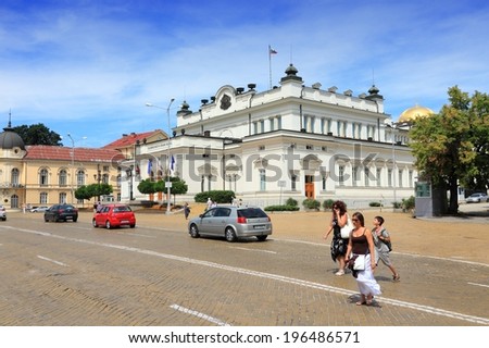 SOFIA, BULGARIA - AUGUST 17, 2012: People cross the street illegally in front of National Assembly in Sofia, Bulgaria. Sofia is the largest city of Bulgaria with around 1.3 million people.