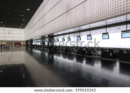 BARCELONA, SPAIN - NOVEMBER 6, 2012: Travelers visit El Prat airport in Barcelona, Spain. It is world\'s 35th busiest airport with 34 million passengers handled in 2011.