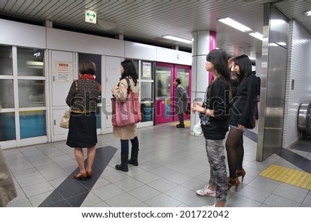 KYOTO, JAPAN - APRIL 14, 2012: People wait for Kyoto Municipal Subway train in Kyoto, Japan. Kyoto Subway exists since 1981, has 29 stations and is 28.8km long.
