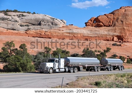 MOAB, UNITED STATES - JUNE 23, 2013: Peterbilt truck drives a scenic road in Utah, USA. Peterbilt is one of most famous American truck manufacturers. It was founded in 1939.