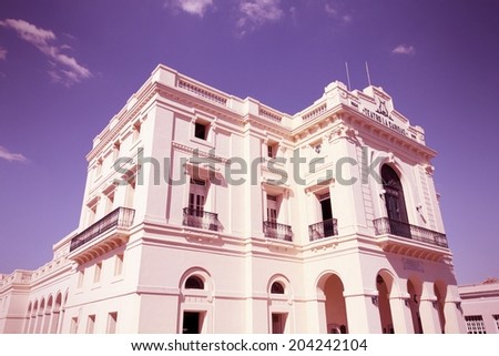 Architecture in Santa Clara, Cuba. Famous Caridad theater. Cross processed color tone - retro style filtered image.