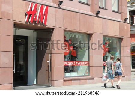 WROCLAW, POLAND - JULY 6, 2014: People shop at H&M fashion store in Wroclaw. H&M is an international fashion retail corp known for its fast fashion approach. Founded in 1947, it employs 87,000 people.