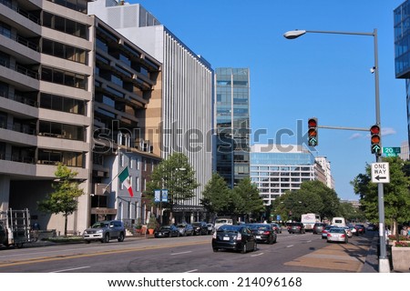 WASHINGTON, USA - JUNE 14, 2013: People drive in downtown Washington, DC. 65 percent of households in Washington DC own a car.