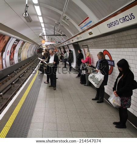 LONDON, UK - MAY 14, 2012: Travelers wait at Oxford Circus underground station on May 14, 2012 in London. London Underground is the 11th busiest metro system worldwide with 1.1 billion annual rides.