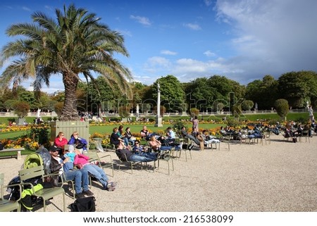 PARIS, FRANCE - JULY 23, 2011: Tourists visit Luxembourg Gardens in Paris, France. Paris is the most visited city in the world with 15.6 million international arrivals in 2011.